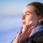 Portrait,Of,Beautiful,Woman,Applying,Cosmetic,Skin,Cream,On,Face